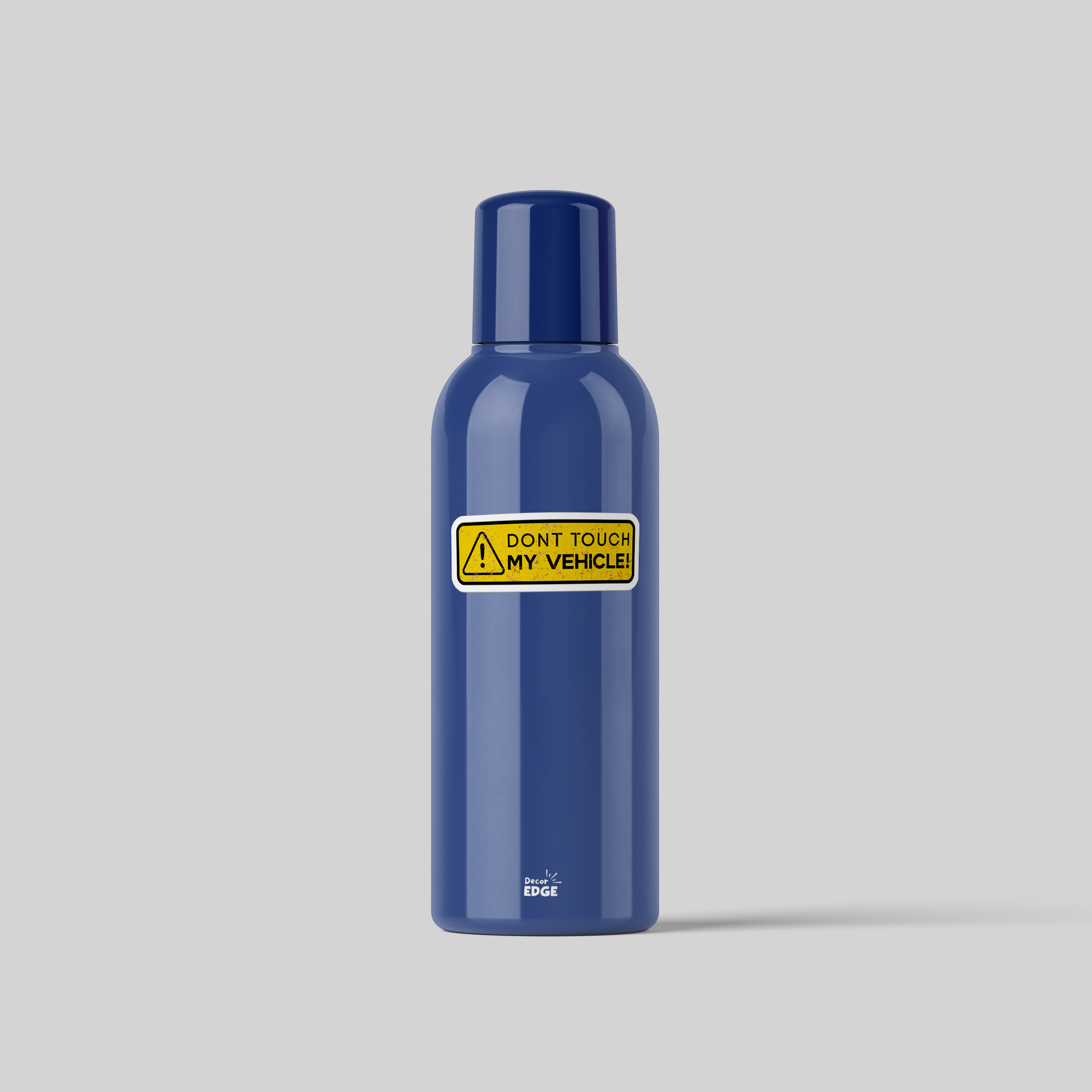 Blue bottle with a yellow dont touch my vehicle sticker from DecorEdge on gray background